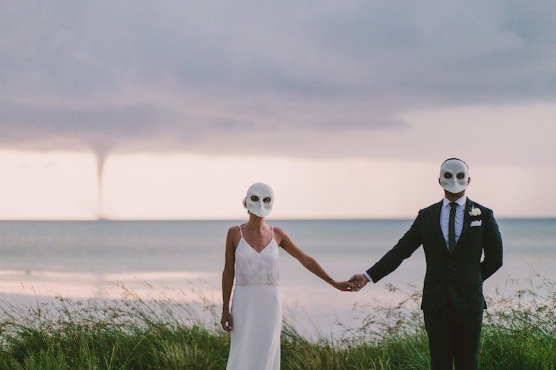 Wedding couple holding hands at Holbox Destination Wedding