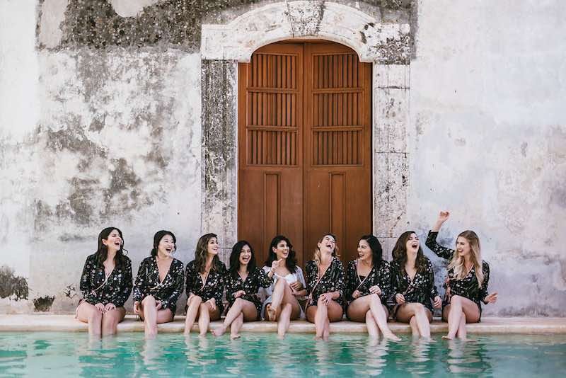 bridemaids and bride having fun by the pool at destination wedding in Yucatan